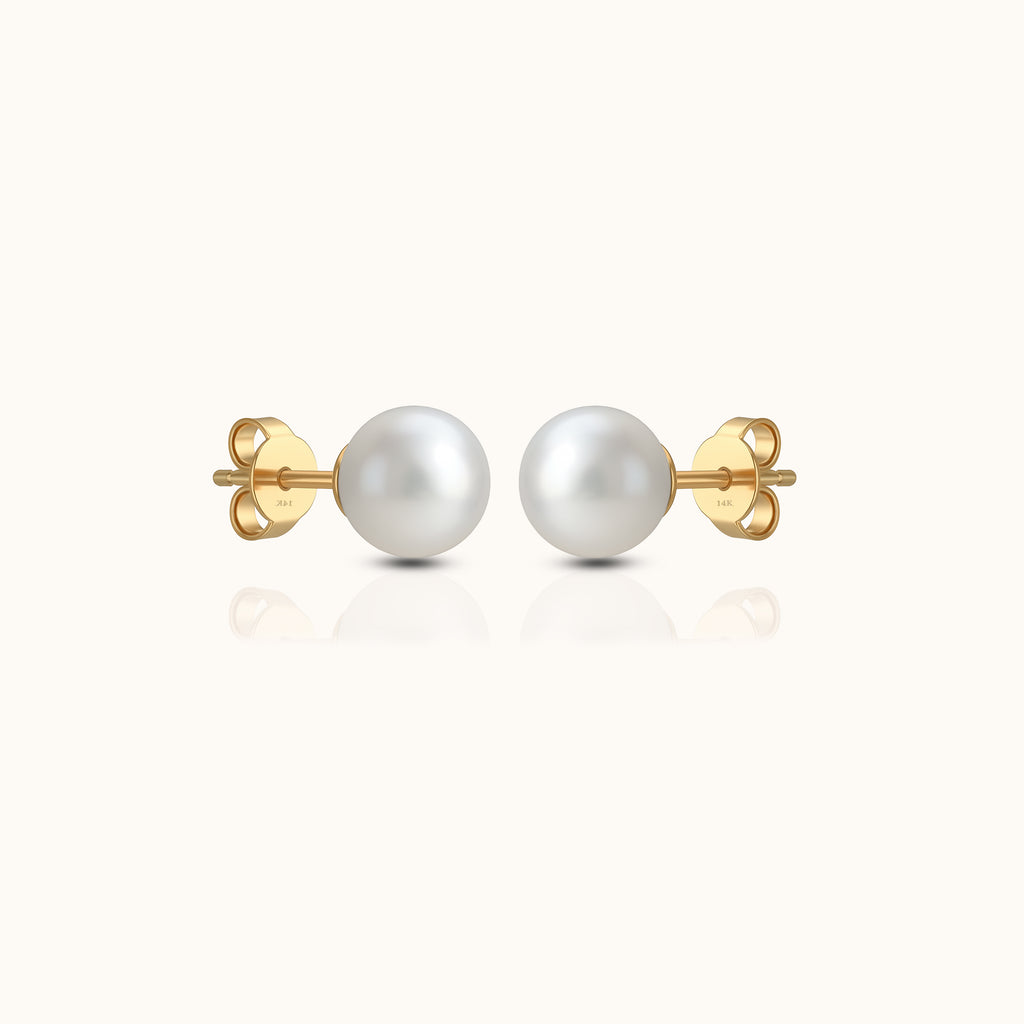 Soft, luminous, and forever refined — the Ever Grace studs capture the quiet beauty of timeless elegance. Featuring two perfectly round Akoya pearls set in 14K solid gold, this pair radiates natural luster and effortless charm. A symbol of grace and love, they are the perfect accents for everyday wear, bridal moments, or meaningful gifting.