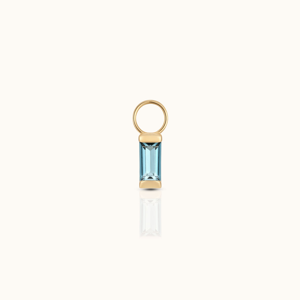 DOVIANA 14K solid gold ear charm with a baguette-cut blue topaz gemstone in a polished geometric setting