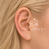 DOVIANA NYC curated ear piercing featuring 14K solid gold flat back earrings, tiny CZ studs, tri dot earrings, and a gold hoop for minimalist everyday piercing jewelry in New York