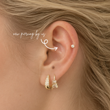 DOVIANA NYC 14K Solid Gold Round 3mm CZ Bezel Flat Back Earring styled in a curated ear piercing with gold pavé hoop and baguette charm earring for minimalist fine piercing jewelry in New York.
