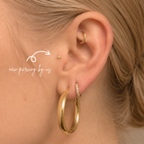 DOVIANA NYC 14K star flat back earring styled in a curated ear piercing with gold hoop earrings and minimalist fine piercing jewelry for everyday ear stacks in New York.
