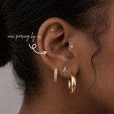 DOVIANA NYC 2mm black titanium flat back earring styled in a curated ear piercing with gold hoops, star flat back stud, mini rocket flatback and minimalist piercing jewelry for everyday ear stacks in New York.