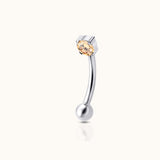 DOVIANA implant-grade titanium internally threaded curved barbell with a round champagne CZ in a four-prong setting and a polished ball end.