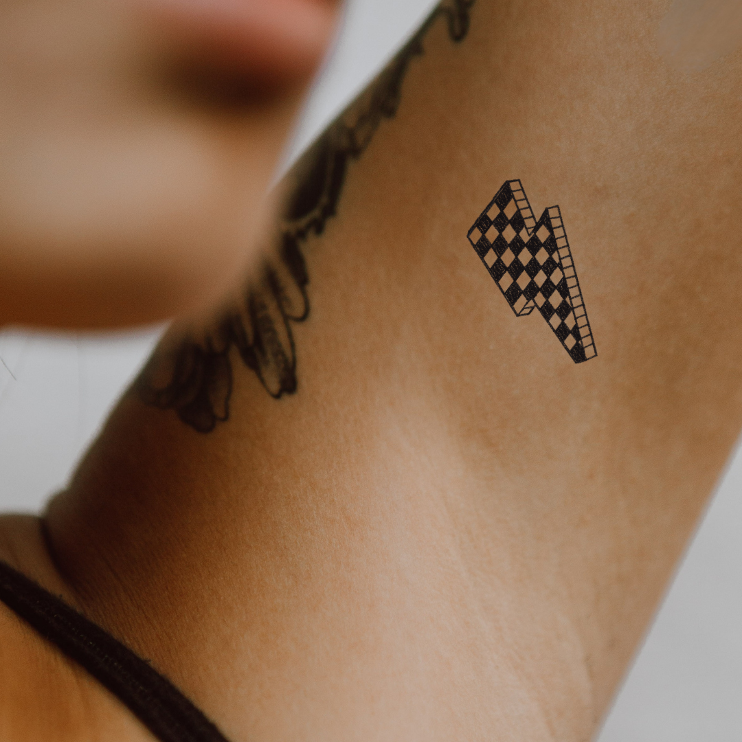 Checkerboard Bolt – Bold Energy with a Retro Twist by DOVIANA Tattoo Studio (height 0.6‘’) 