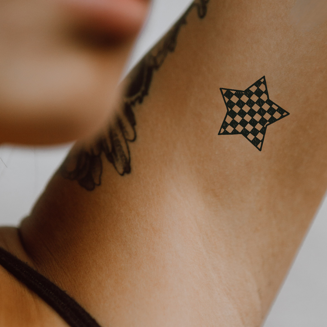 Checkerboard Star – Retro Edge Meets Classic Cool by DOVIANA Tattoo Studio (height 0.55‘’)