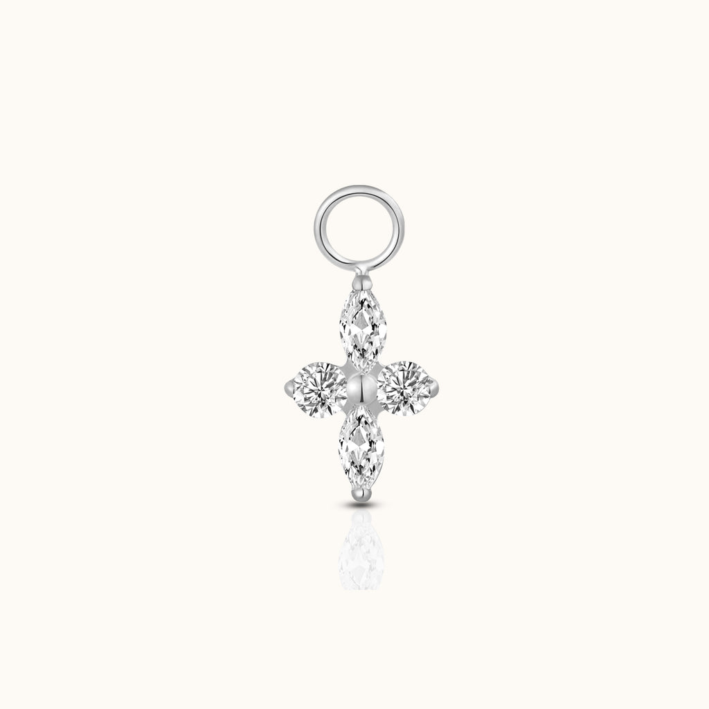 DOVIANA implant-grade titanium ear charm with two marquise-cut and two round clear CZ stones arranged in a polished silver-tone four-petal design.