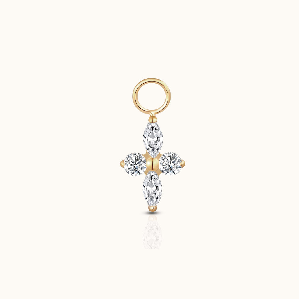 DOVIANA implant-grade titanium ear charm with two marquise-cut and two round clear CZ stones in a four-petal design with an 18K PVD gold finish.