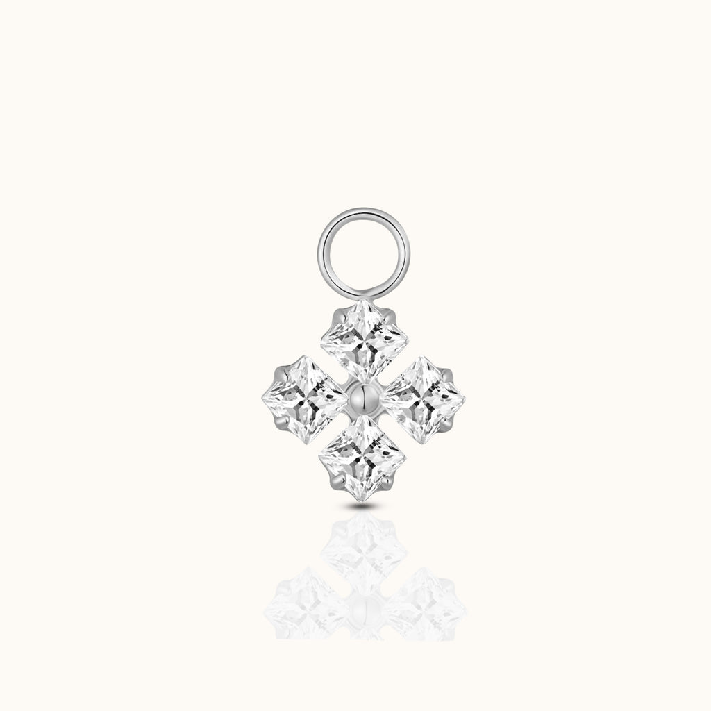 DOVIANA implant-grade titanium ear charm with four princess-cut clear CZ stones arranged in a polished silver-tone geometric cluster.