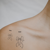 Ribbon Bow — A Symbol of Grace & Feminine Charm by DOVIANA Tattoo Studio (height 0.5‘’)