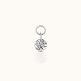 DOVIANA implant-grade titanium ear charm with a round brilliant-cut clear CZ and polished silver-tone connector rings.