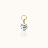 DOVIANA PVD gold titanium ear charm with a round brilliant-cut clear CZ stone and polished connector ring.