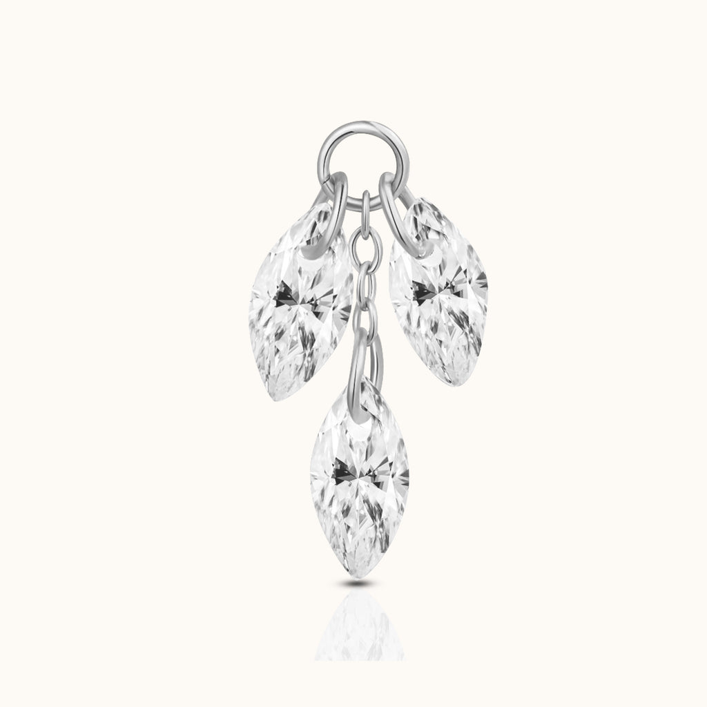 DOVIANA implant-grade titanium ear charm with three dangling marquise-cut clear CZ stones and polished silver-tone connector rings.