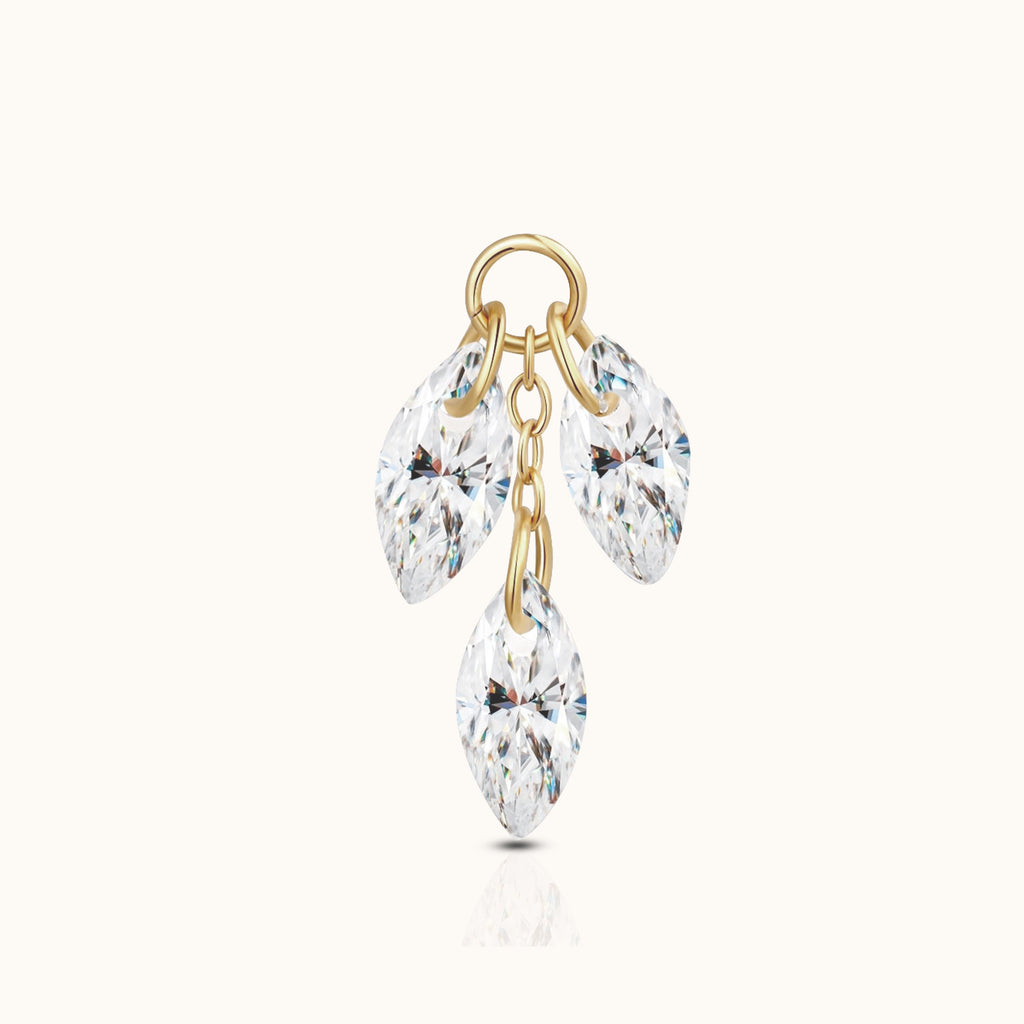 DOVIANA implant-grade titanium ear charm with three dangling marquise-cut clear CZ stones and an 18K PVD gold finish.