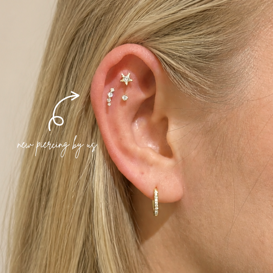 DOVIANA 14K Solid Gold Graduated CZ Wave Arc Climber Threadless Flat Back Earring styled in a fresh flat piercing, featuring graduated cubic zirconia stones and professional ear styling in Manhattan, New York.