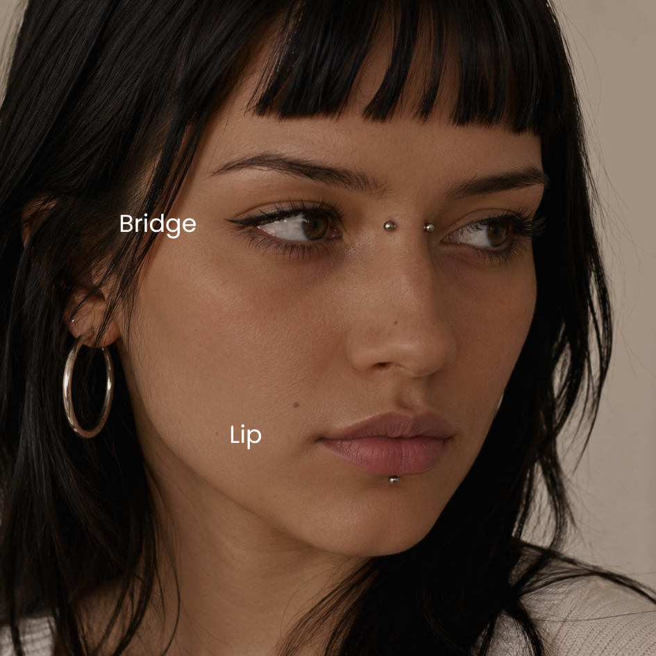 Portrait featuring bridge piercing and centered labret lip piercing with implant grade titanium jewelry styled in a minimalist facial piercing aesthetic at DOVIANA NYC.