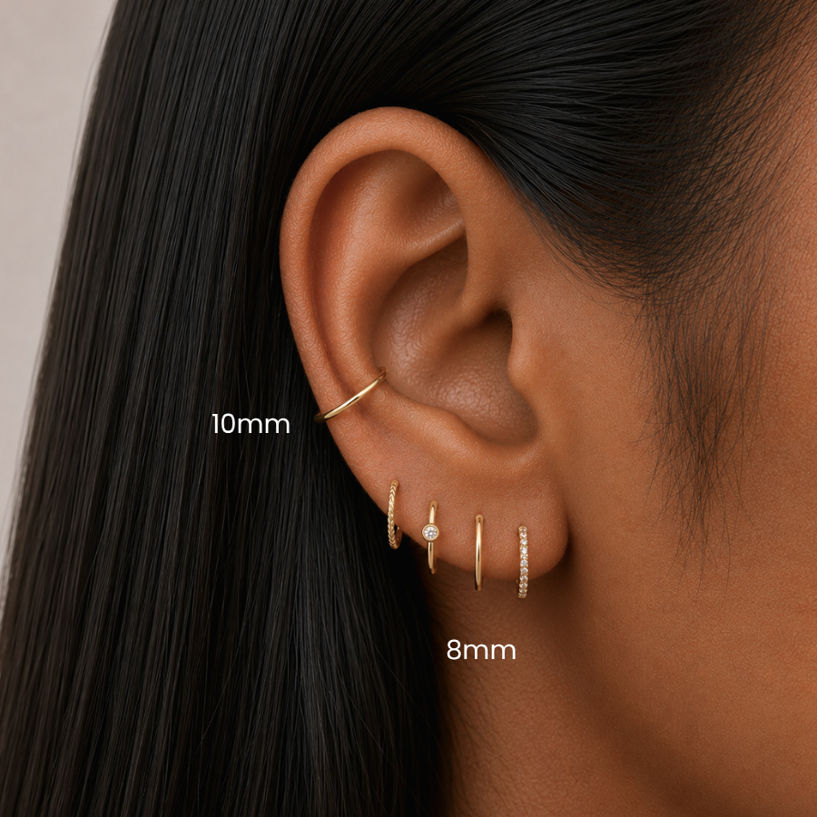 DOVIANA Classic Clicker 10mm Titanium PVD Gold Hinged Hoop Earring styled in a conch piercing, 8mm hoop in a upper lobe, featuring implant-grade titanium, a seamless hinged closure, and curated ear styling in Manhattan, New York.