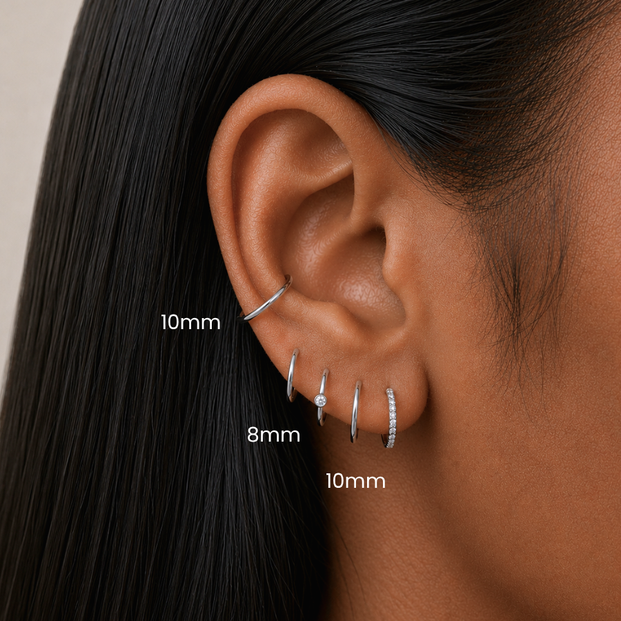 DOVIANA Classic Clicker 10mm Titanium Hinged Hoop Earring styled in a conch piercing, 8mm hoop in a upper lobe, featuring implant-grade titanium, a seamless hinged closure, and curated ear styling in Manhattan, New York.