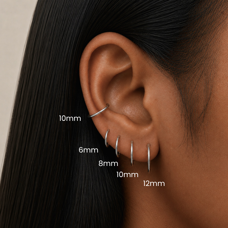 DOVIANA medical grade titanium clicker hoop earrings size guide showing 6mm, 8mm, 10mm, and 12mm hinged hoops styled in lobe, upper lobes and conch piercings for cartilage and ear stack styling.