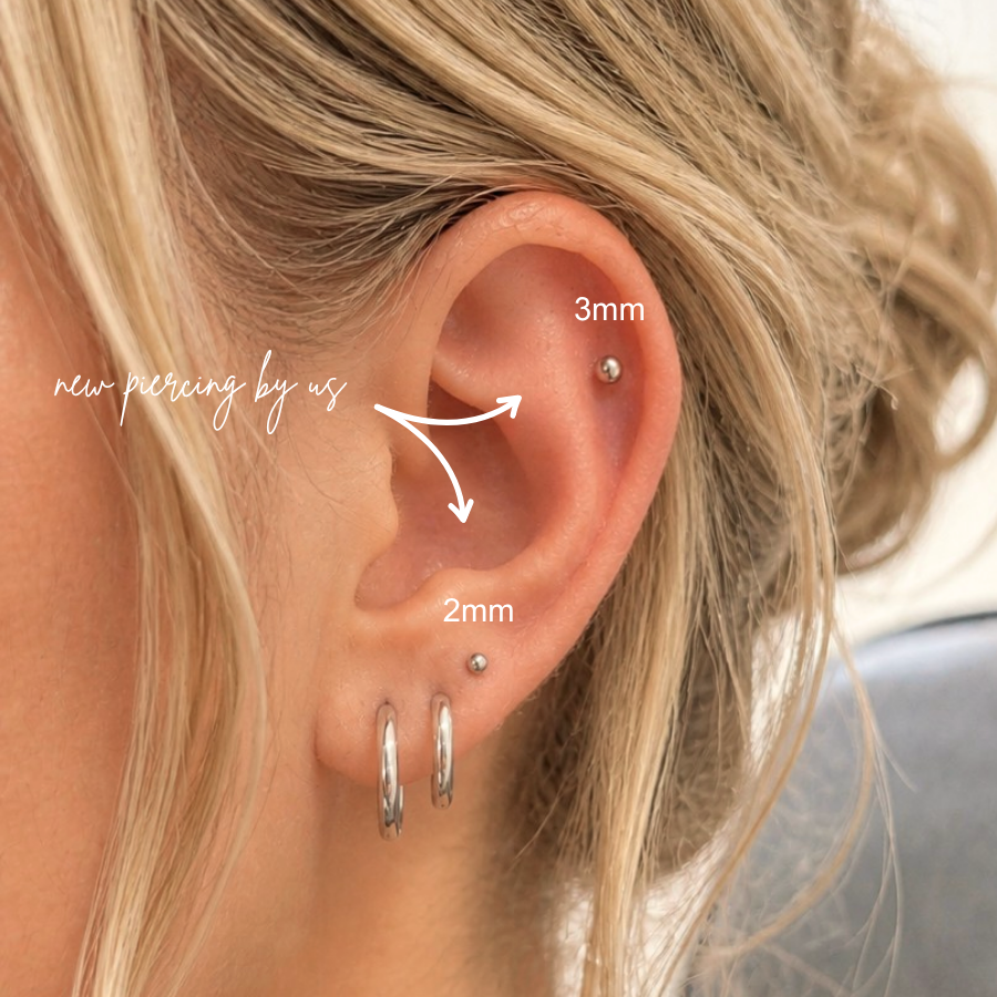 DOVIANA NYC 2mm and 3mm ball flat back earrings styled in a curated ear piercing with silver hoop earrings and minimalist piercing jewelry for everyday ear stacks in New York.