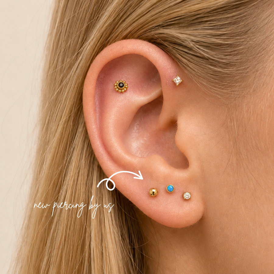 DOVIANA NYC curated ear piercing featuring gold flat back earrings, turquoise opal stud, CZ lobe stud, helix jewelry, and minimalist 14K gold piercing jewelry in New York.
