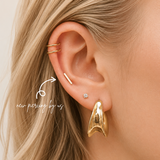 DOVIANA NYC curated ear piercing featuring a gold double ear cuff, minimalist bar stud, CZ lobe stud, and bold gold hoop earring for everyday piercing jewelry in New York.