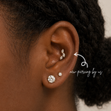 DOVIANA NYC leaf flat back earring styled in a curated ear piercing with CZ lobe studs and minimalist fine piercing jewelry for everyday ear stacks in New York.