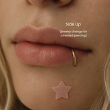 Close-up of healed side labret piercing - lip piercing with 14K gold hoop jewelry change at DOVIANA NYC featuring minimalist body piercing jewelry and professional piercing service.