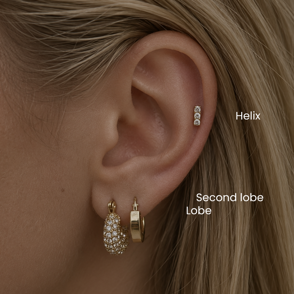 DOVIANA NYC helix and mid helix piercing service featuring a CZ bar stud and gold huggie earrings for curated ear styling in New York.