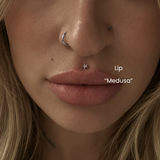DOVIANA NYC lip piercing service featuring a Medusa piercing with a titanium star flat back stud, styled with nostril jewelry for professional body piercings in New York, needle piercing only.