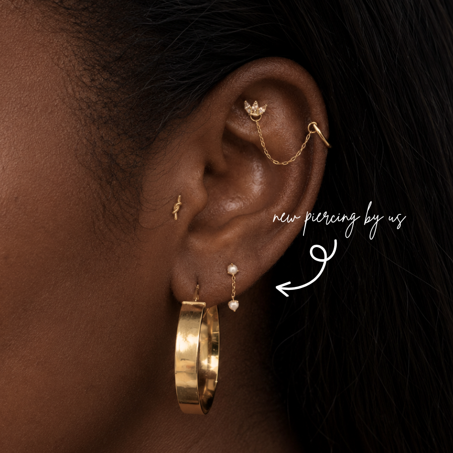 DOVIANA NYC pearl dangle flat back earring styled in a curated ear piercing with a gold hoop, crystal chain cartilage earring, and minimalist fine piercing jewelry in New York.