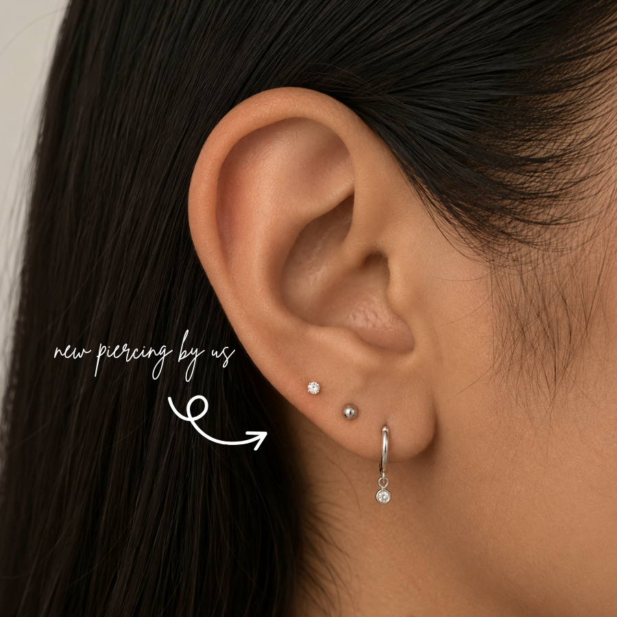 DOVIANA NYC titanium 2mm flat back earring styled in a minimalist curated ear piercing with a tiny CZ stud and silver drop hoop for everyday piercing jewelry in New York.
