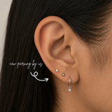 DOVIANA NYC titanium 2mm flat back earring styled in a minimalist curated ear piercing with a tiny CZ stud and silver drop hoop for everyday piercing jewelry in New York.