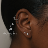 DOVIANA NYC titanium heart flat back earring styled in a silver curated ear piercing with helix hoop, CZ stud, marquise lobe stud, and minimalist piercing jewelry in New York.