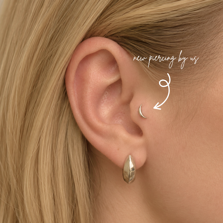DOVIANA NYC titanium moon flat back earring styled in a minimalist silver curated ear piercing with a sleek lobe earring for everyday piercing jewelry in New York.