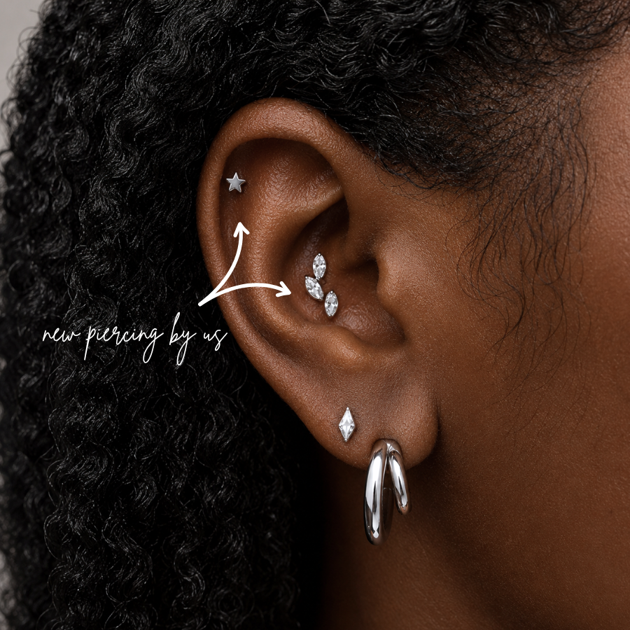 DOVIANA NYC titanium star flat back earring styled in a curated ear piercing with silver hoops, crystal leaf stud, kite lobe stud, and minimalist piercing jewelry for everyday ear stacks in New York.
