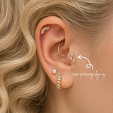 Fresh forward helix piercing by DOVIANA NYC in Manhattan, New York, featuring a marquise cluster earring, professional cartilage piercing services, and personalized ear styling.