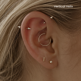 DOVIANA NYC vertical helix piercing service featuring a silver spike barbell and curated ear jewelry for professional ear piercings in New York.